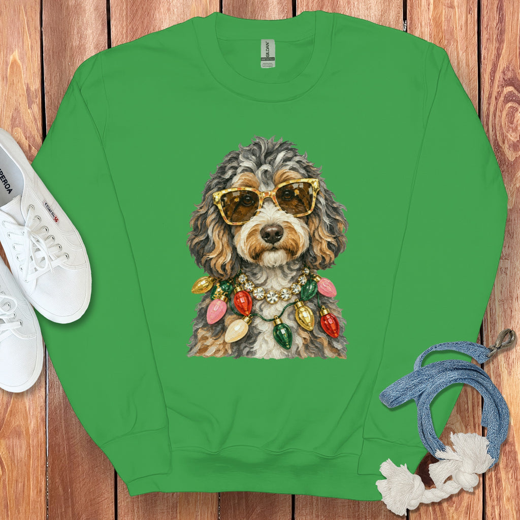 Green crewneck sweatshirt with a doodle dog wearing sunglasses and Christmas lights.