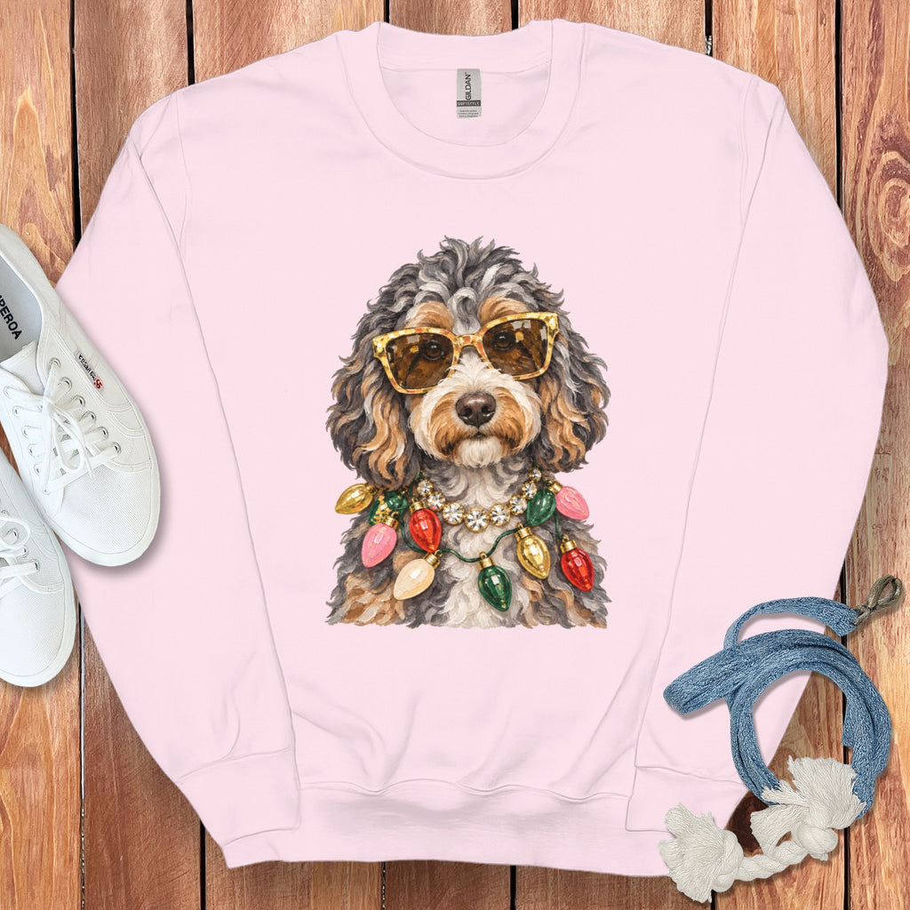 Pink crewneck sweatshirt with a dog wearing sunglasses and a Christmas light necklace.