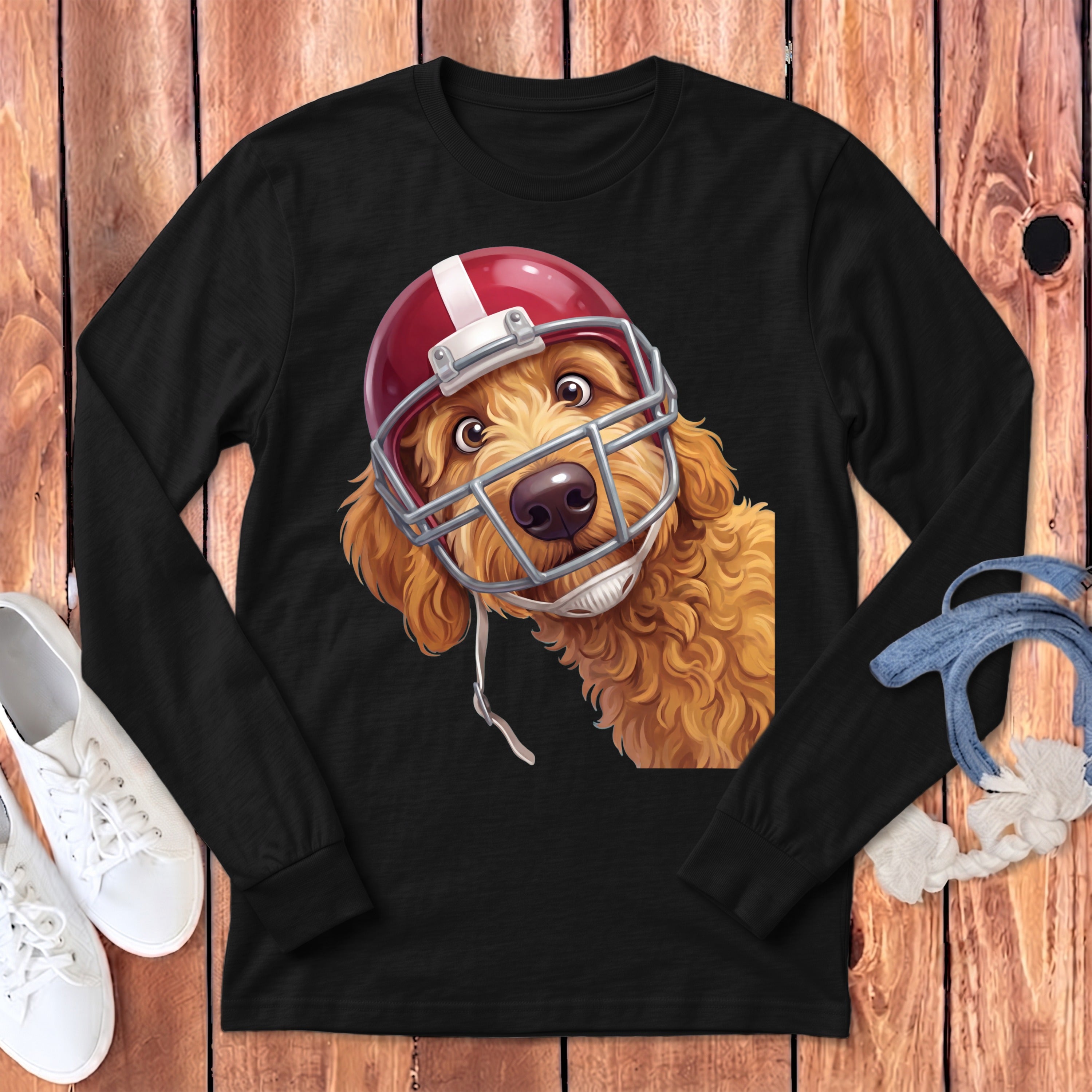 Black long-sleeve t-shirt featuring a graphic of a golden doodle dog wearing a football helmet.