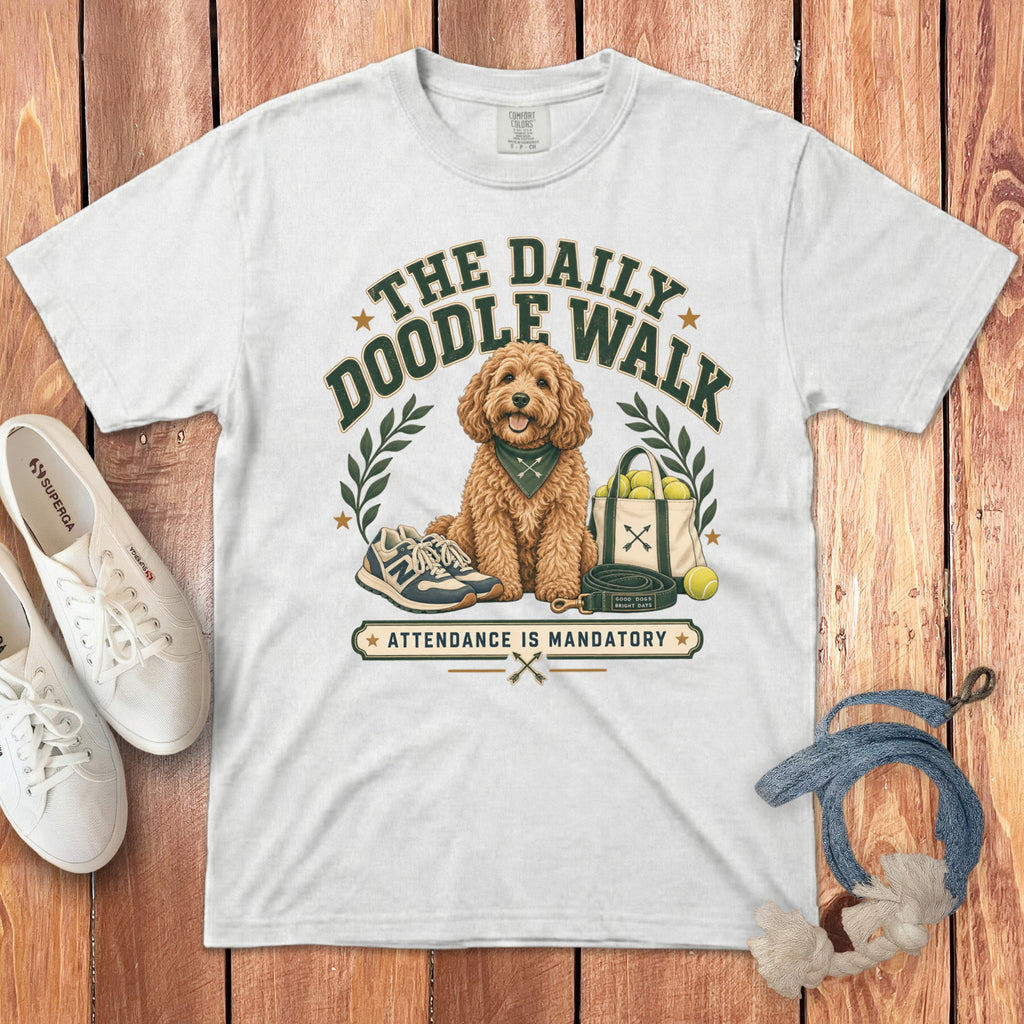 White t-shirt with "The Daily Doodle Walk Attendance is Mandatory" text and dog illustration.
