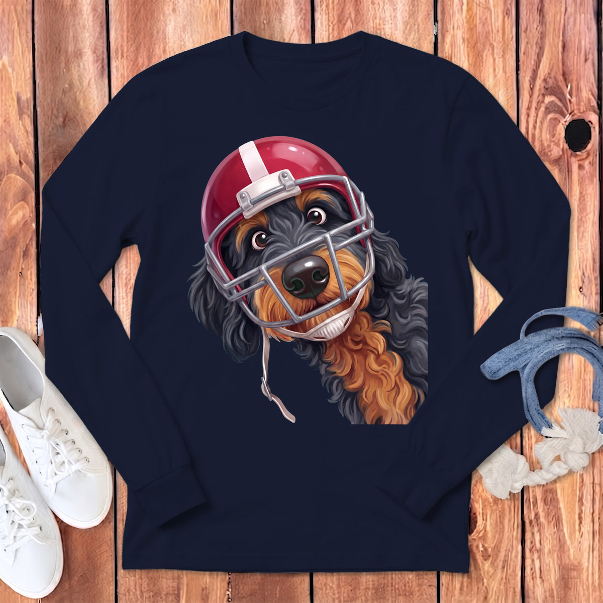 Dark navy long sleeve shirt with a cartoon dog wearing a red and white football helmet.
