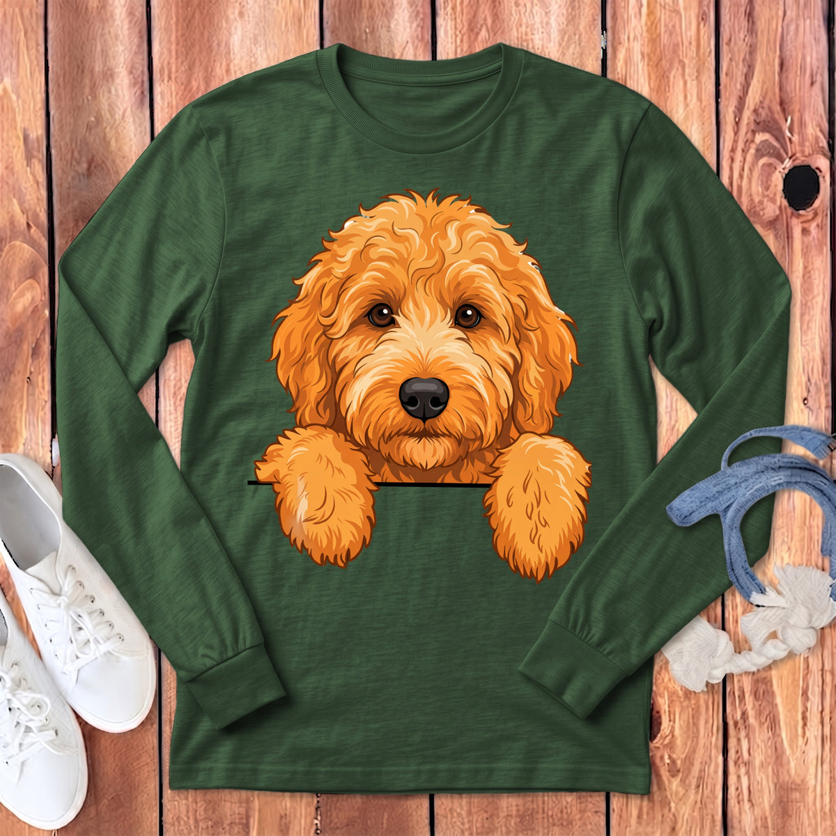 Green long-sleeve t-shirt with an illustrated goldendoodle peeking from a pocket.
