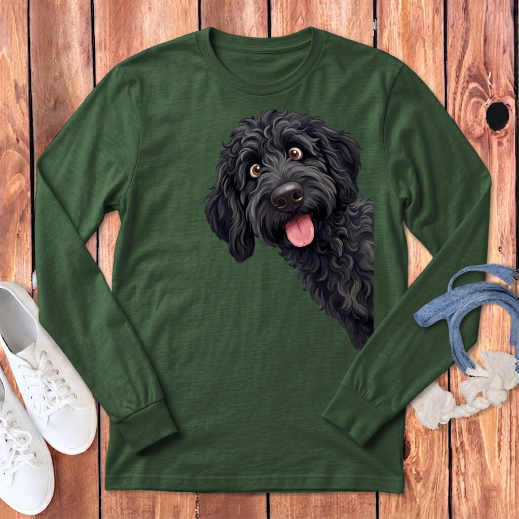 Green long-sleeve t-shirt with a black doodle dog graphic and white sneakers.