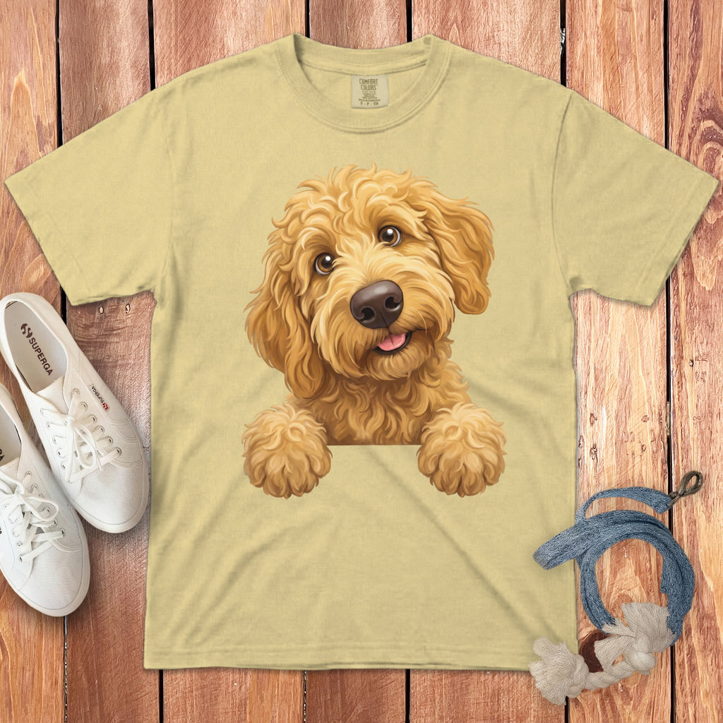 Light yellow t-shirt with a cartoon goldendoodle dog graphic and Superga shoes.