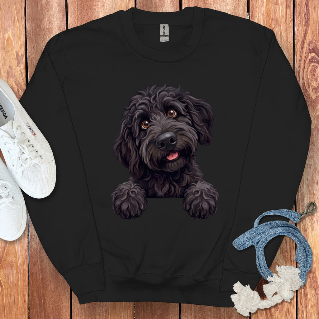 Black sweatshirt with a digital illustration of a black poodle puppy peeking over the collar.
