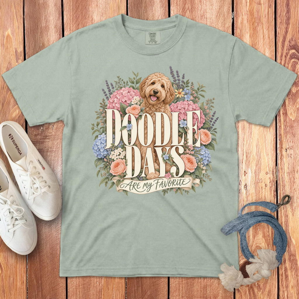 Light green t-shirt with a doodle dog surrounded by flowers, text says "DOODLE DAYS ARE MY FAVORITE".