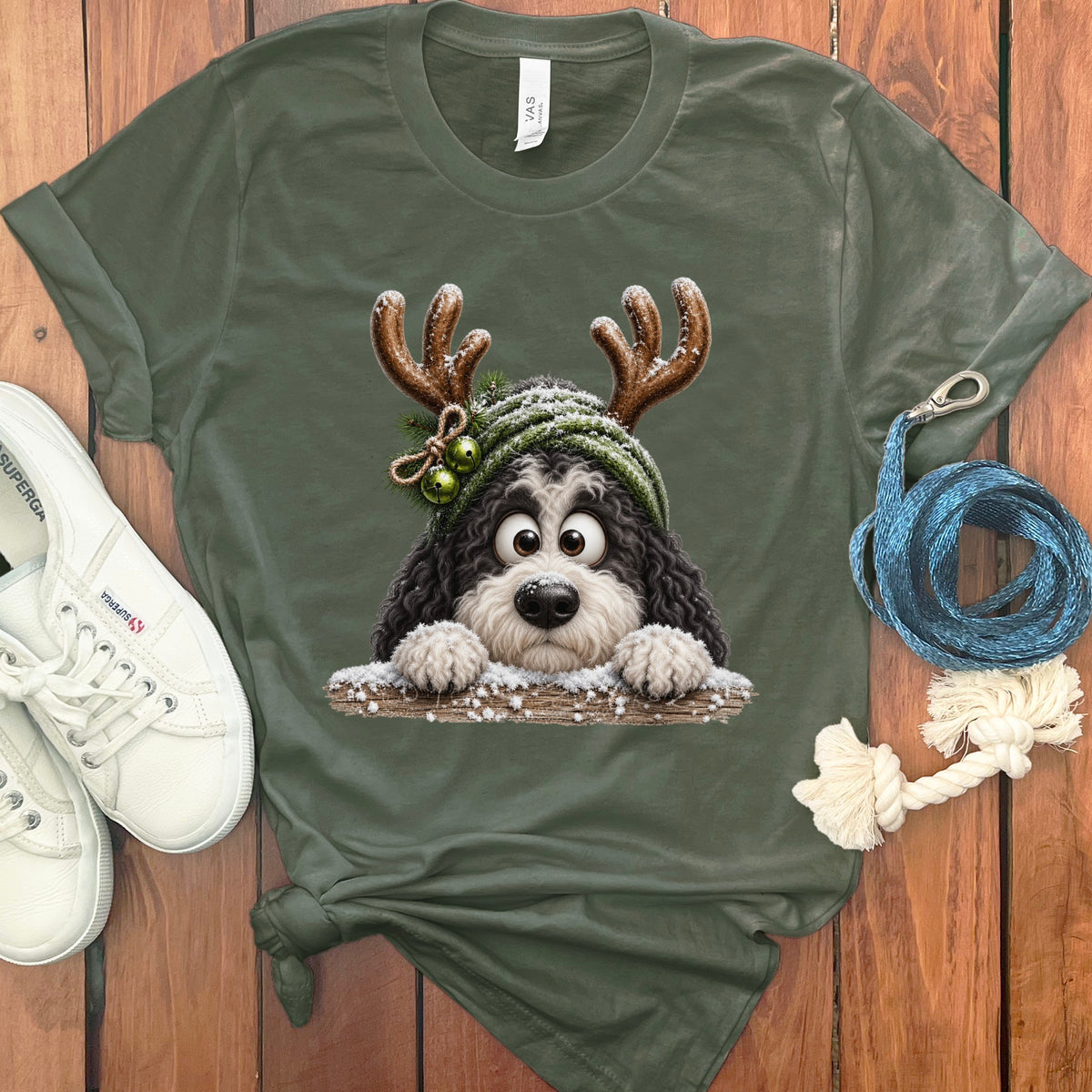 T-shirt with cartoon Bernedoodle dog wearing antlers and winter hat.