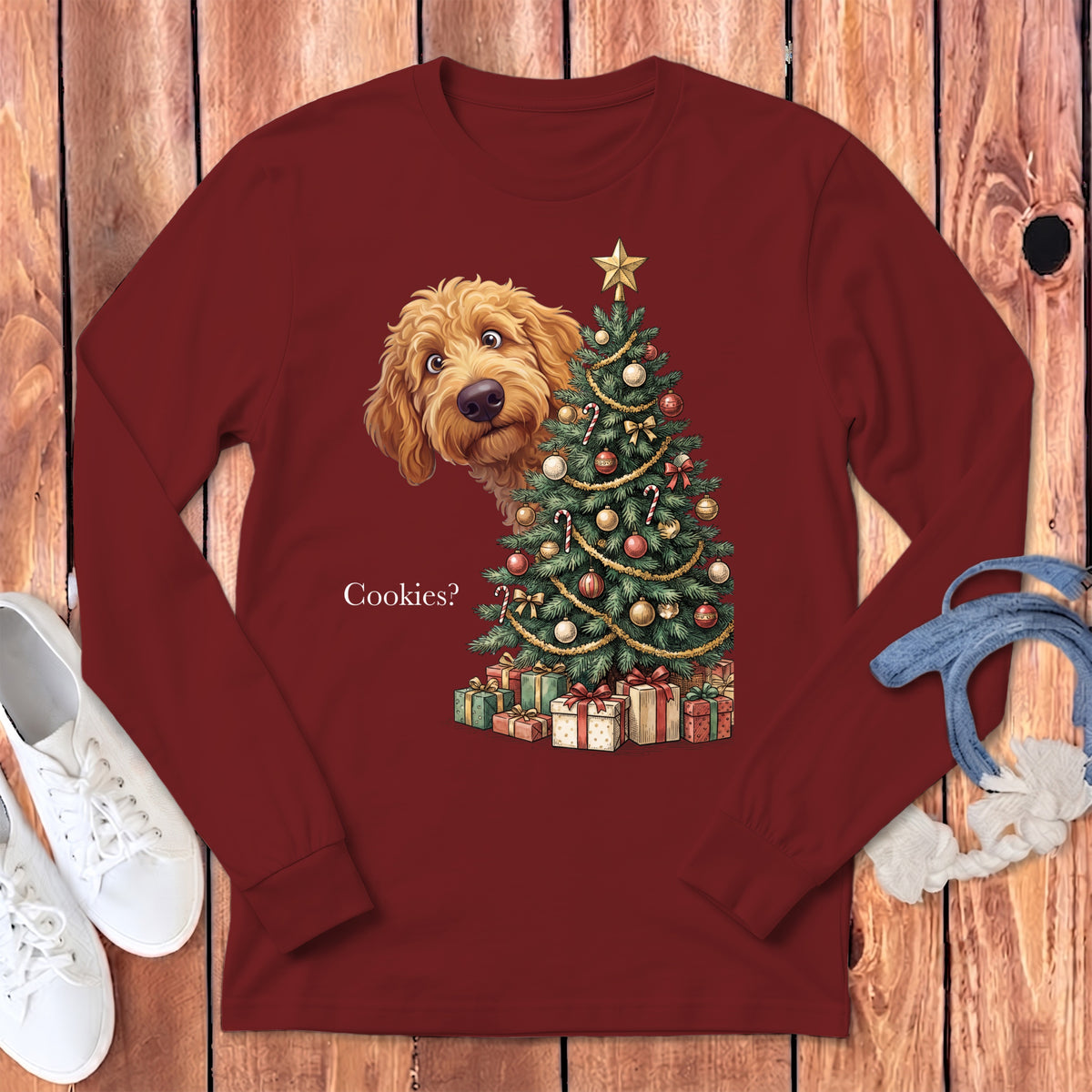 Goldendoodle peeks around a decorated Christmas tree with gifts, text "Cookies?".