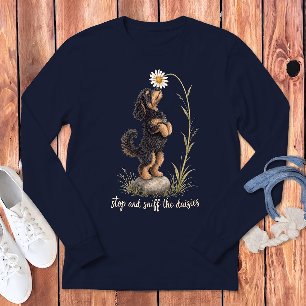 Dark navy long sleeve shirt with a drawing of a dog sniffing a daisy.
