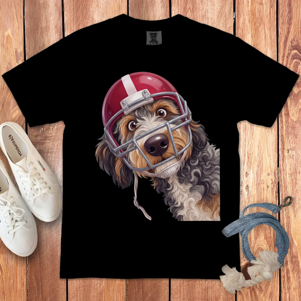 Black t-shirt with a cartoon dog wearing a red and white football helmet.