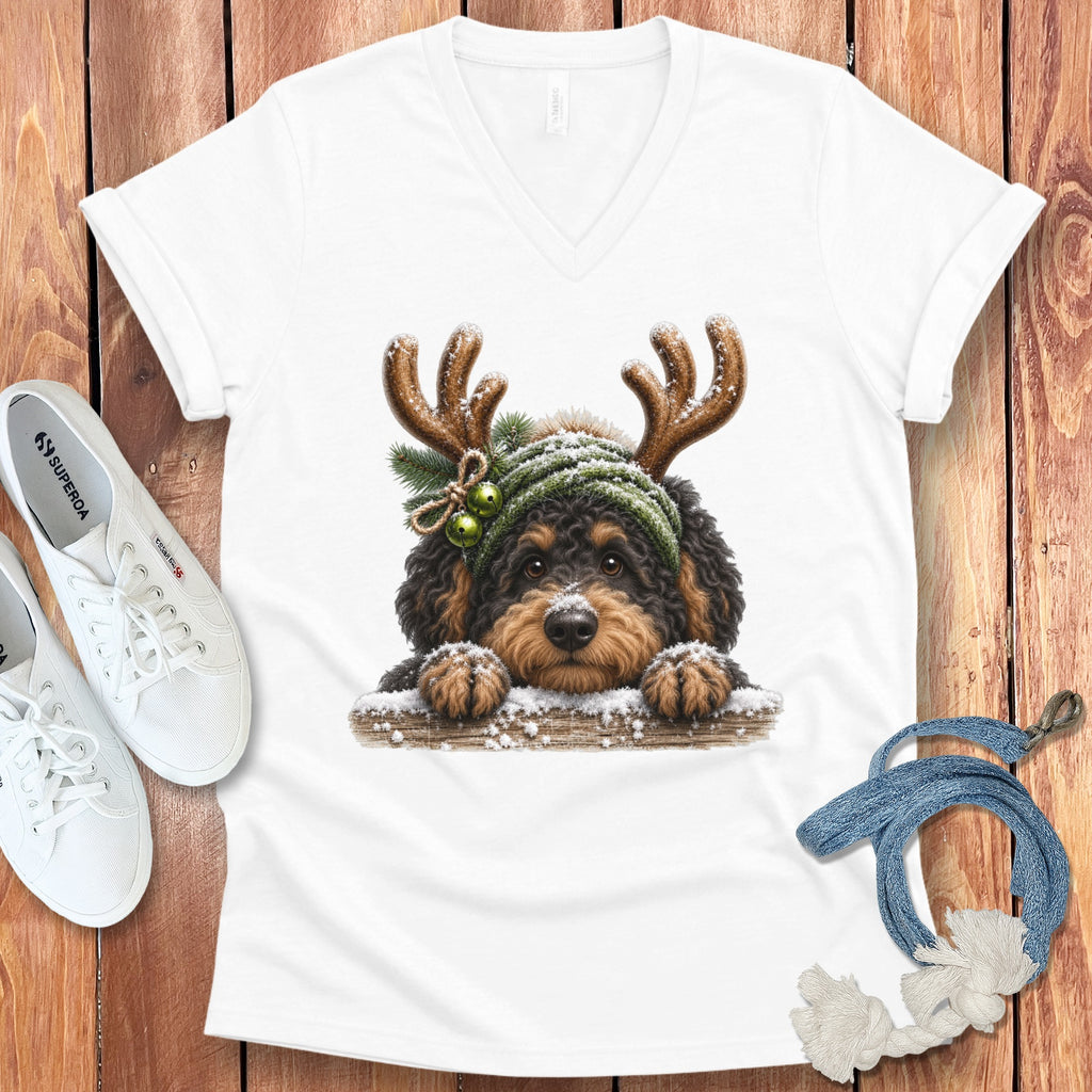White t-shirt with illustration of a fluffy dog wearing antlers and a knit hat.