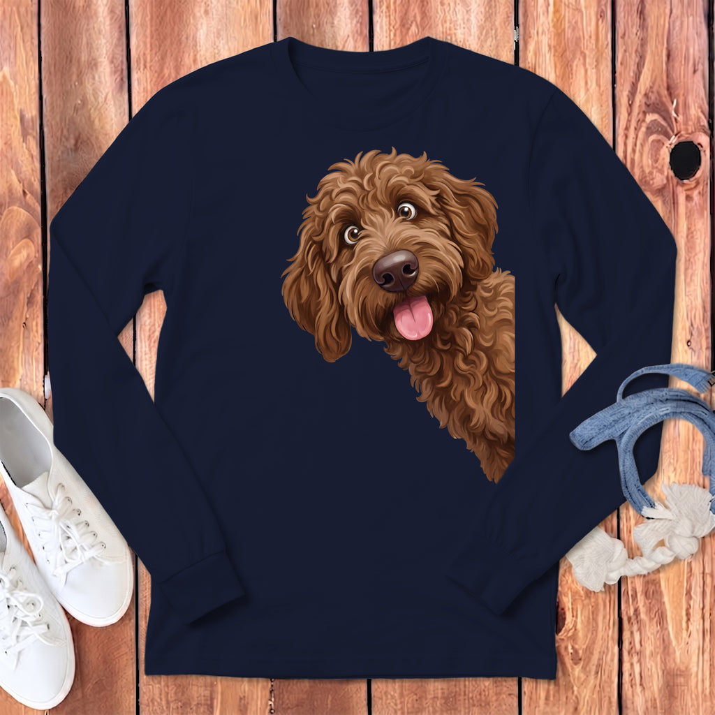 Brown doodle dog peeking from the side of a navy long-sleeve shirt.