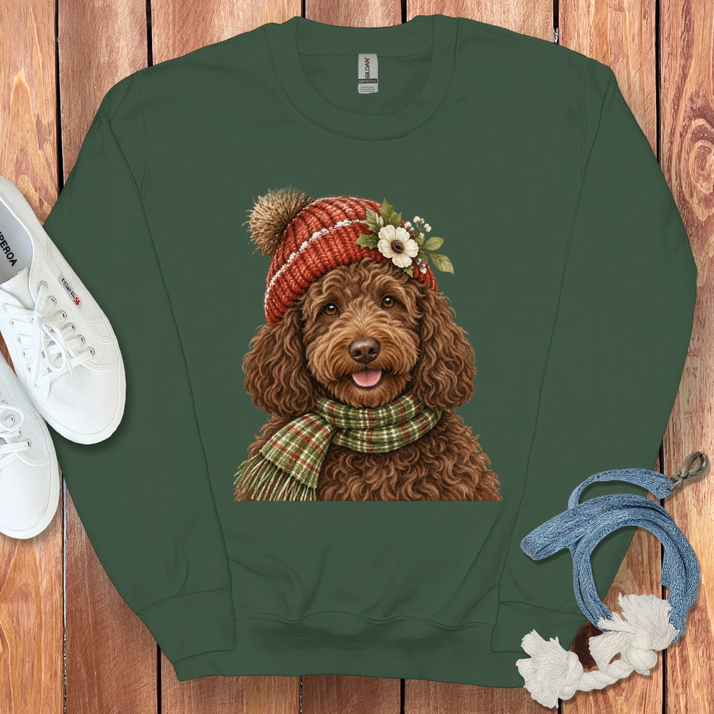 Green sweatshirt featuring a brown doodle dog wearing a red beanie and scarf.