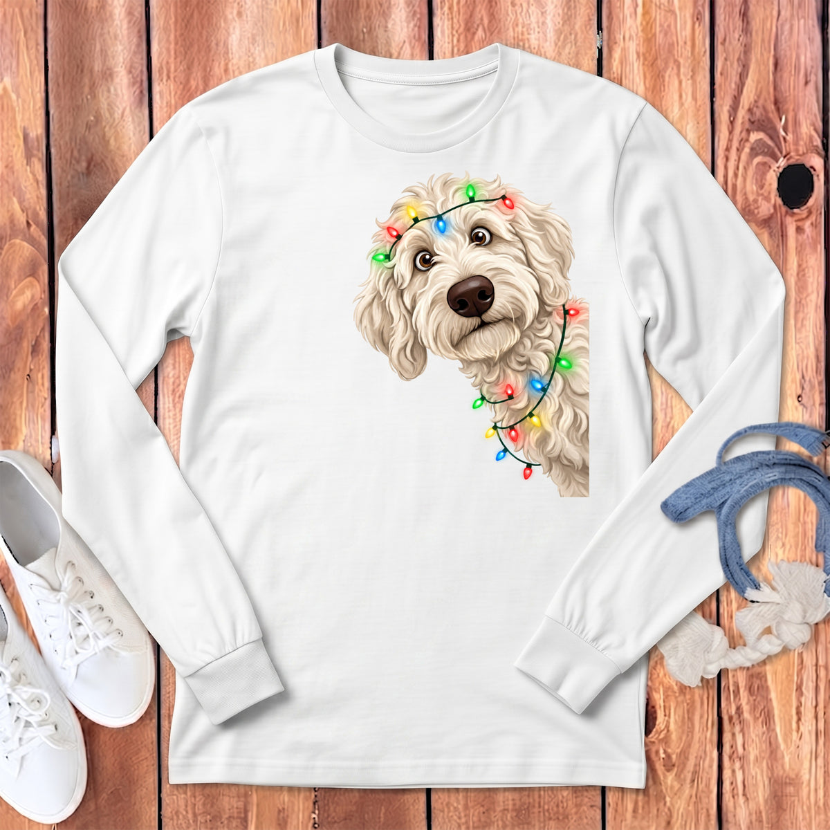 White long sleeve shirt with a fluffy dog wearing Christmas lights.