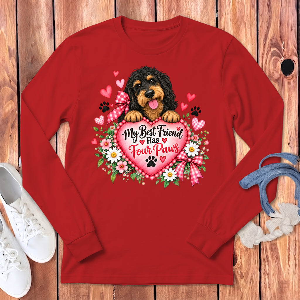 A red long-sleeve shirt with a graphic of a black and tan dog behind a pink heart.