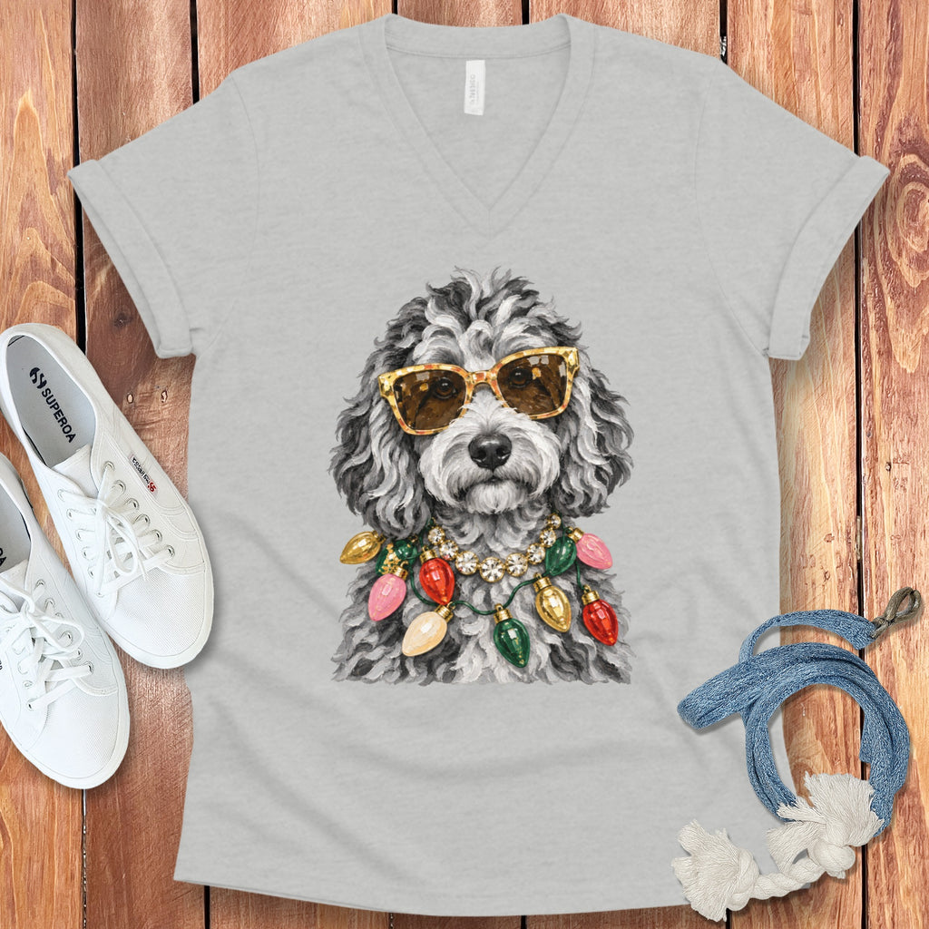 Grey v-neck t-shirt with a doodle wearing sunglasses and Christmas lights.