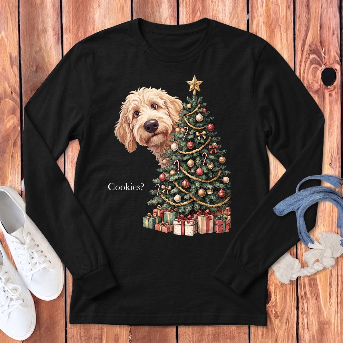 Goldendoodle peeking around Christmas tree with presents and text "Cookies?".