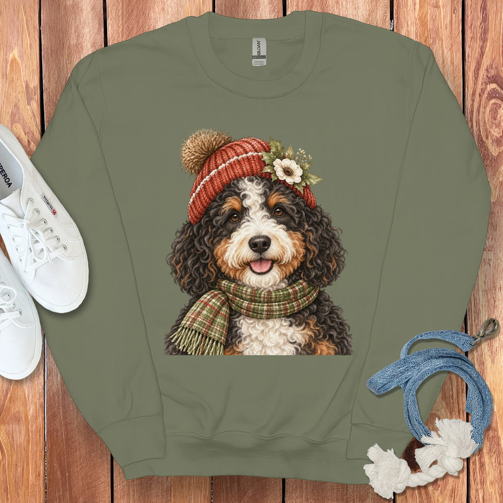 Crewneck sweatshirt with a Bernese Mountain Dog wearing a knit hat and scarf.
