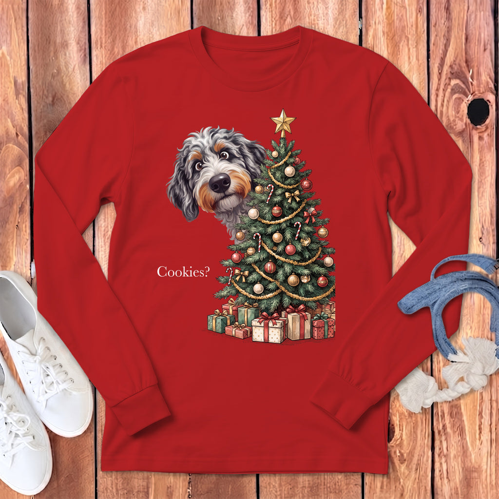 Bernedoodle peeking from behind a Christmas tree with presents and text "Cookies?".