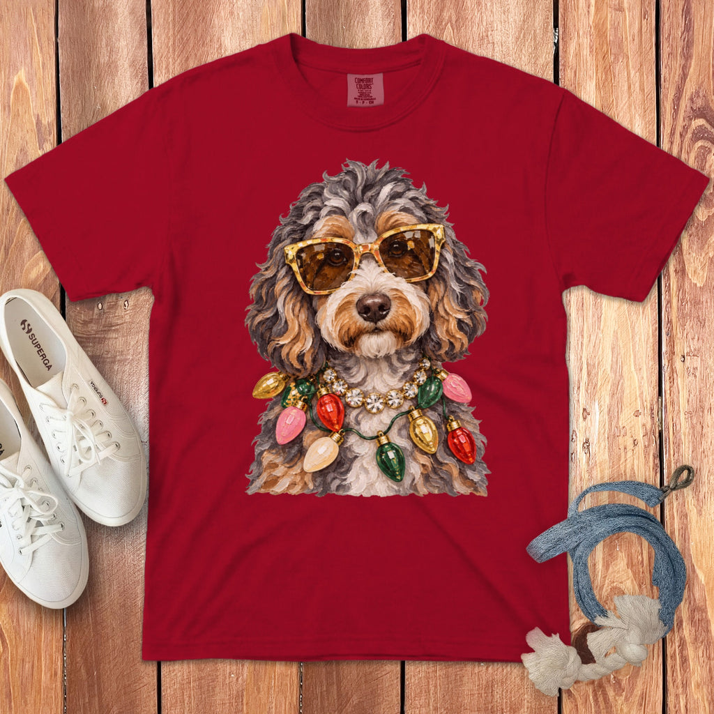 Red t-shirt with a doodle dog wearing sunglasses and Christmas lights.