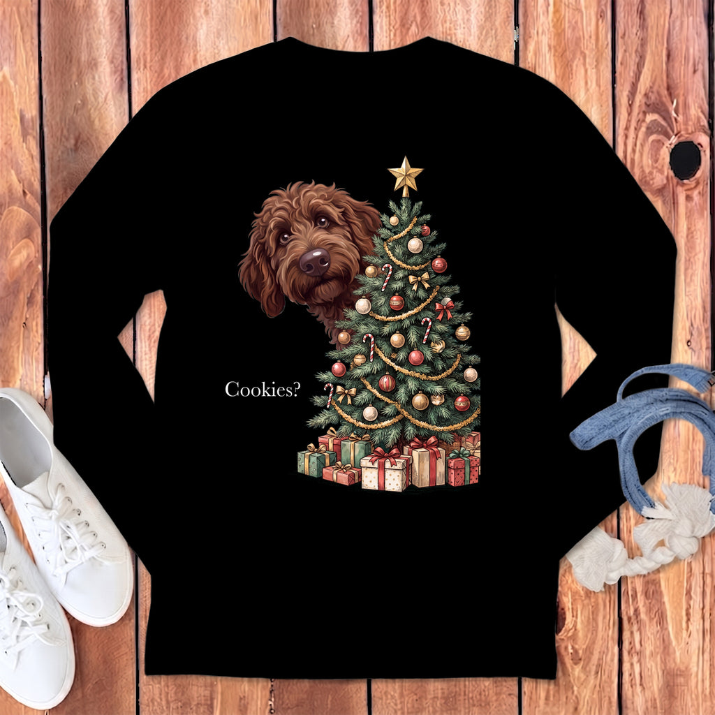 Brown dog peeking at a decorated Christmas tree and presents with text "Cookies?".