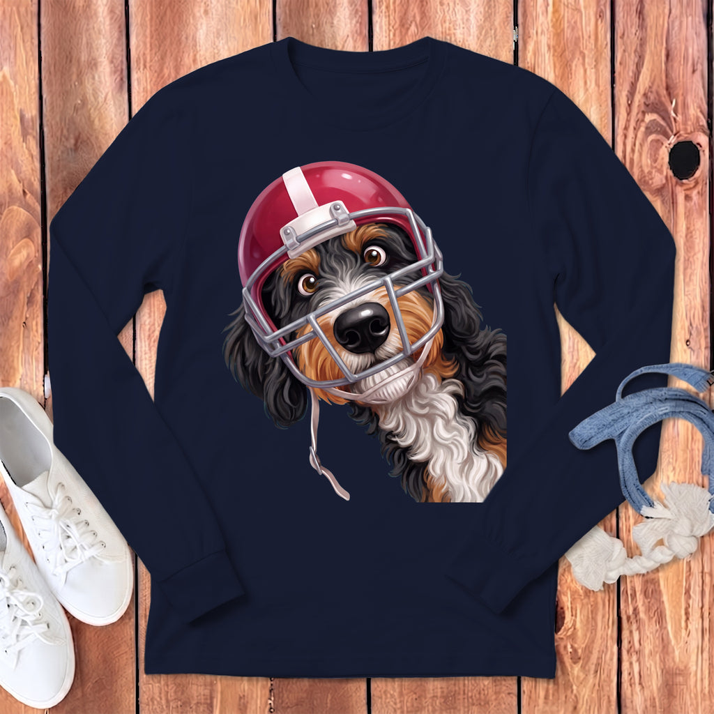 Bernese Mountain Dog wearing a red football helmet and facemask.