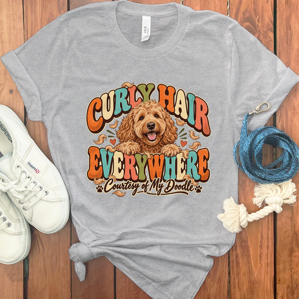 Gray t-shirt with a doodle dog graphic and text "Curly Hair Everywhere Courtesy of My Doodle".