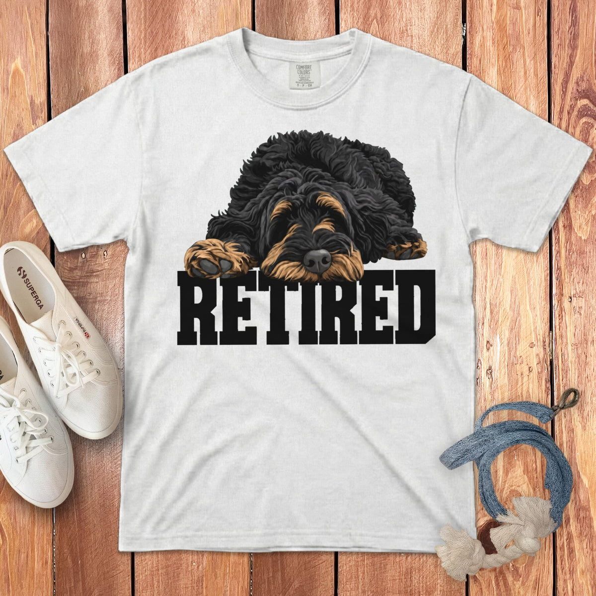 White t-shirt with black and tan dog graphic and "RETIRED" text.