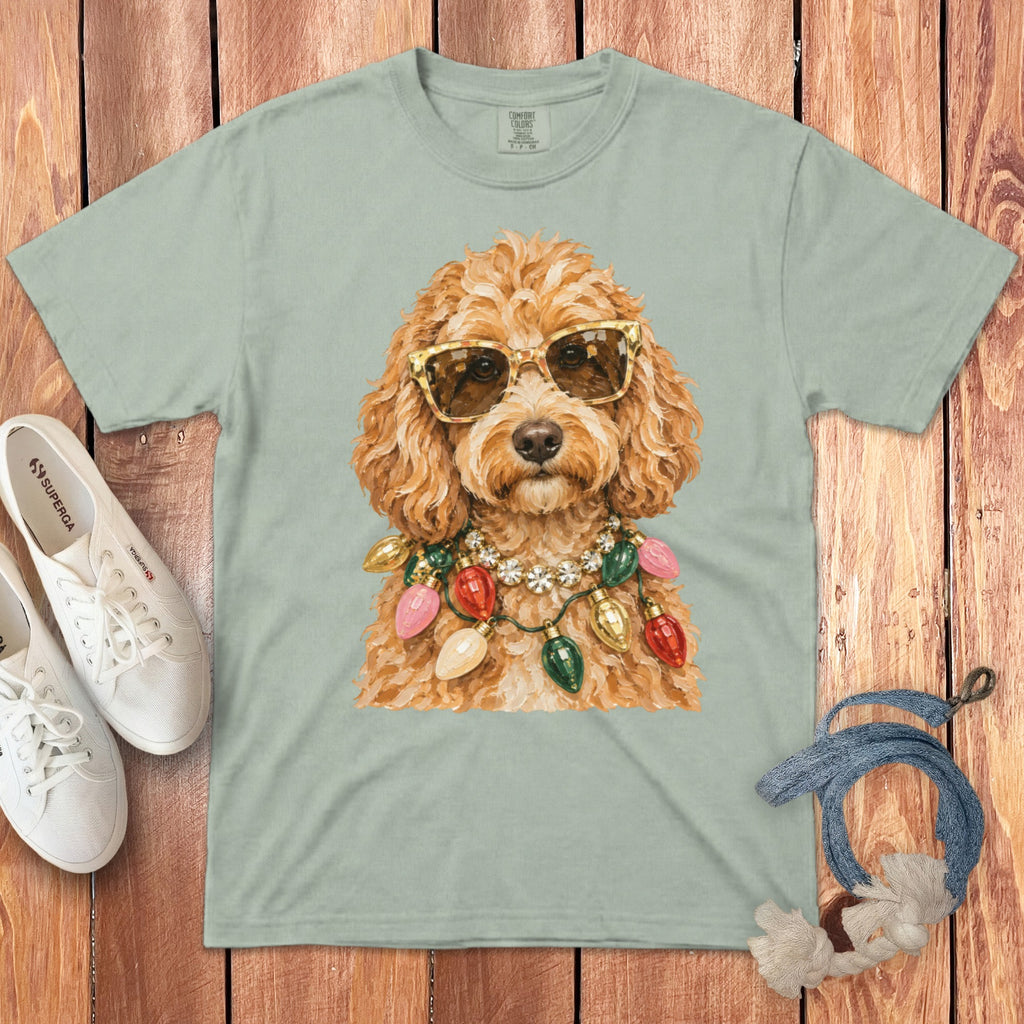 Light green t-shirt featuring a doodle dog wearing sunglasses and a string of Christmas lights.