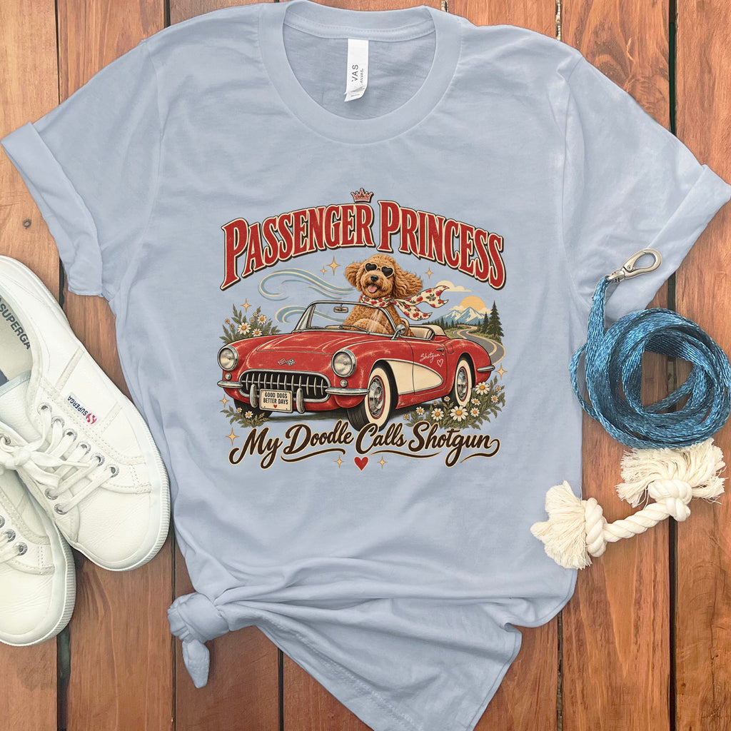 Light blue t-shirt with "Passenger Princess" and dog in car graphic.