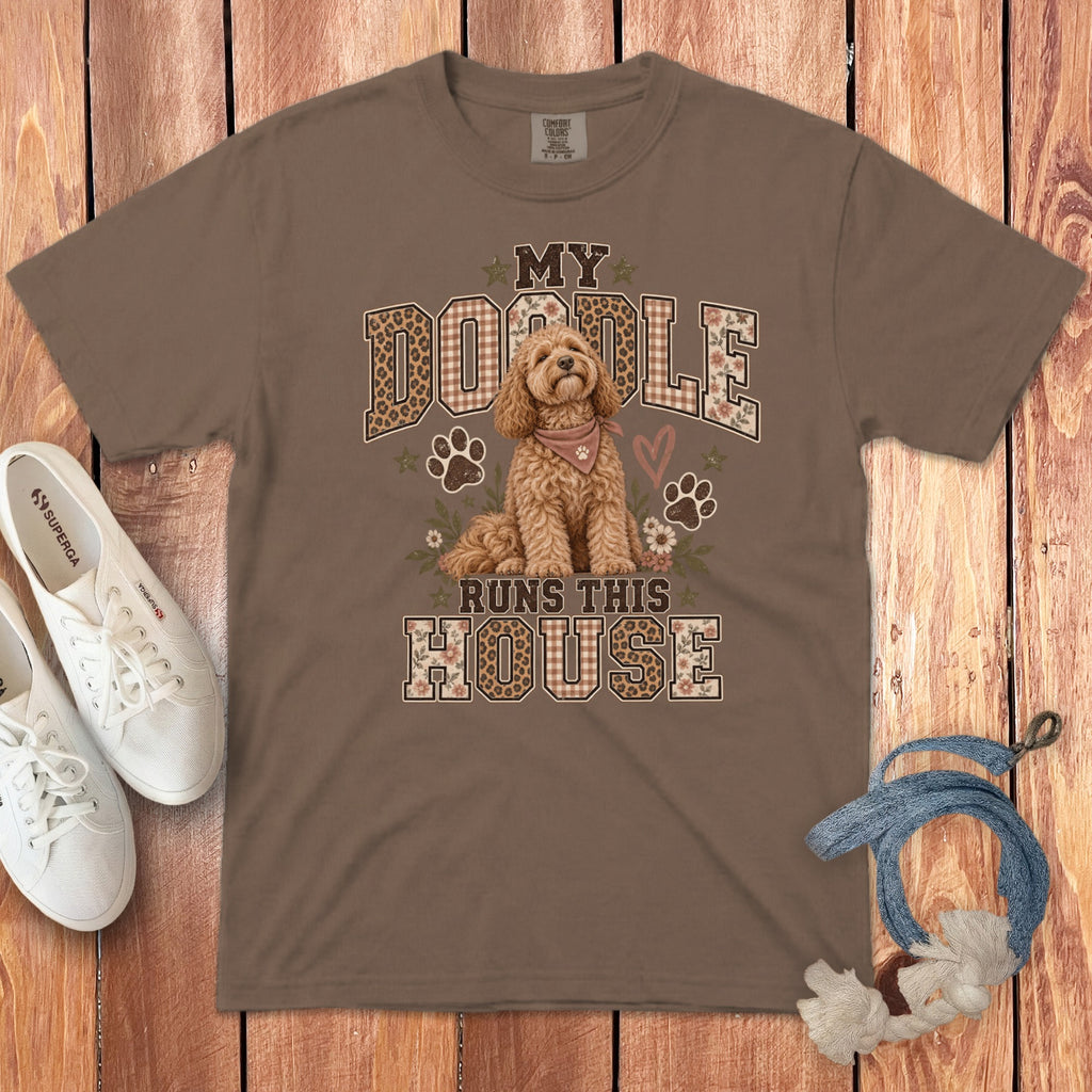 Brown crewneck t-shirt featuring a goldendoodle graphic, paw prints, and the text My Doodle Runs This House.