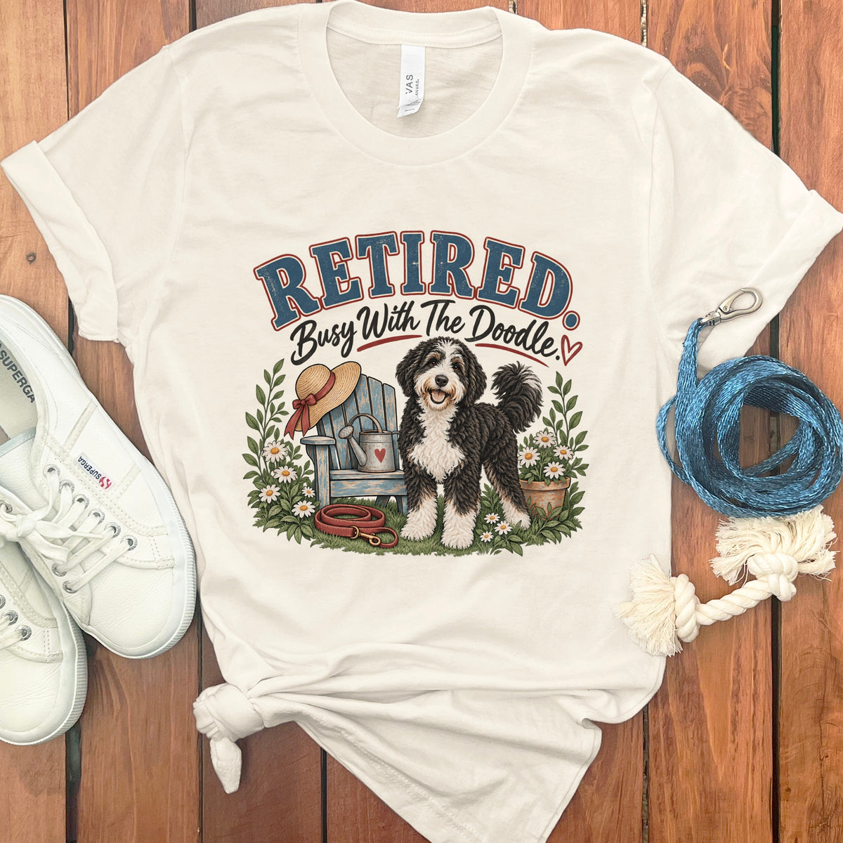 Cream t-shirt with "Retired Busy With The Doodle" graphic and a Bernedoodle dog.