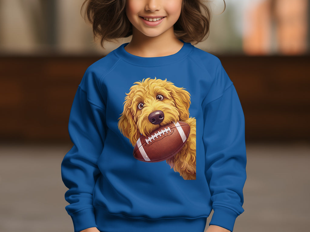 Blue sweatshirt with a cartoon golden doodle dog holding a football.