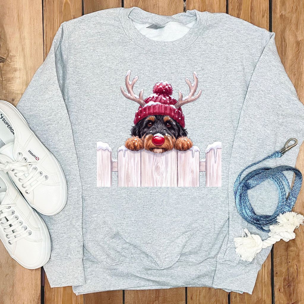 Grey sweatshirt with a festive dog illustration wearing a reindeer hat and red nose.