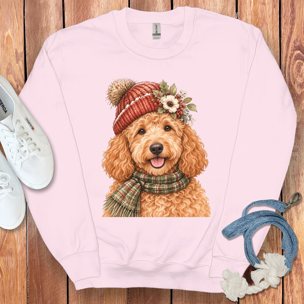 Pink sweatshirt with watercolor doodle dog wearing a knit hat and scarf.