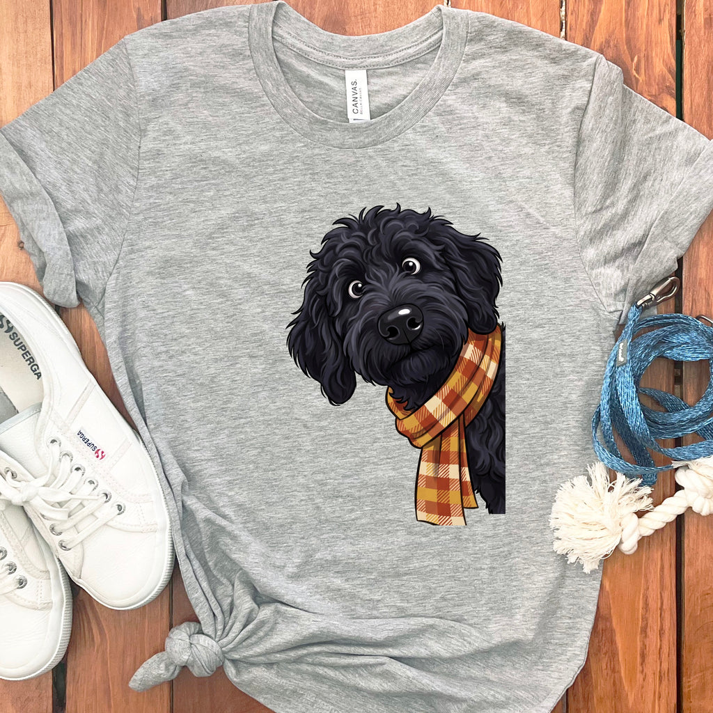 Gray t-shirt with a black doodle-like dog wearing a plaid scarf.