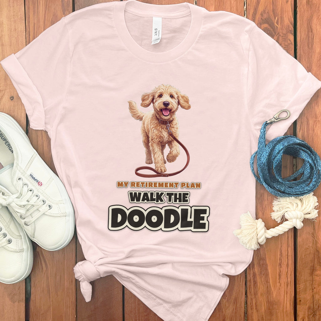 Pink t-shirt with a walking doodle and text "My Retirement Plan Walk The Doodle".