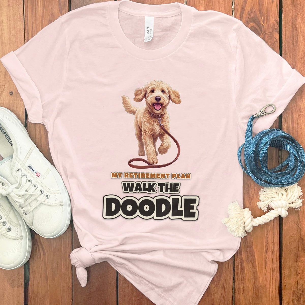 Pink t-shirt with a walking doodle and text "My Retirement Plan Walk The Doodle".