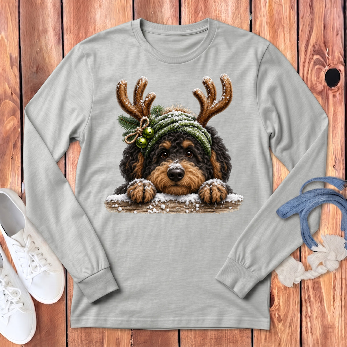 Light gray long sleeve shirt featuring a doodle dog wearing reindeer antlers and a green hat.