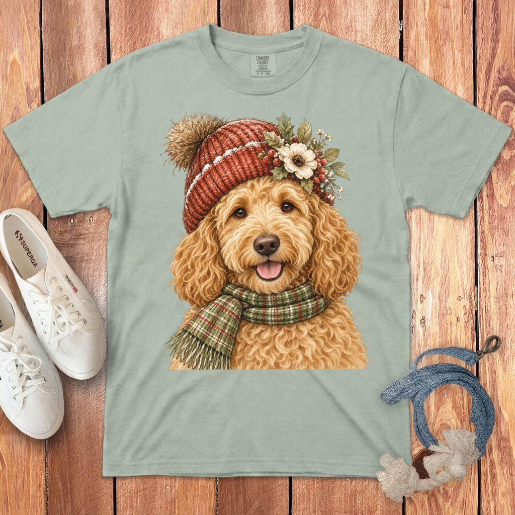 Goldendoodle wearing a knit hat and scarf with floral accents.