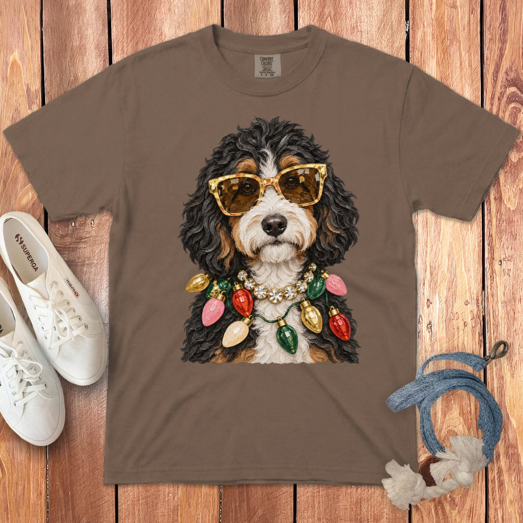 Brown t-shirt with graphic of dog wearing sunglasses and Christmas lights necklace.