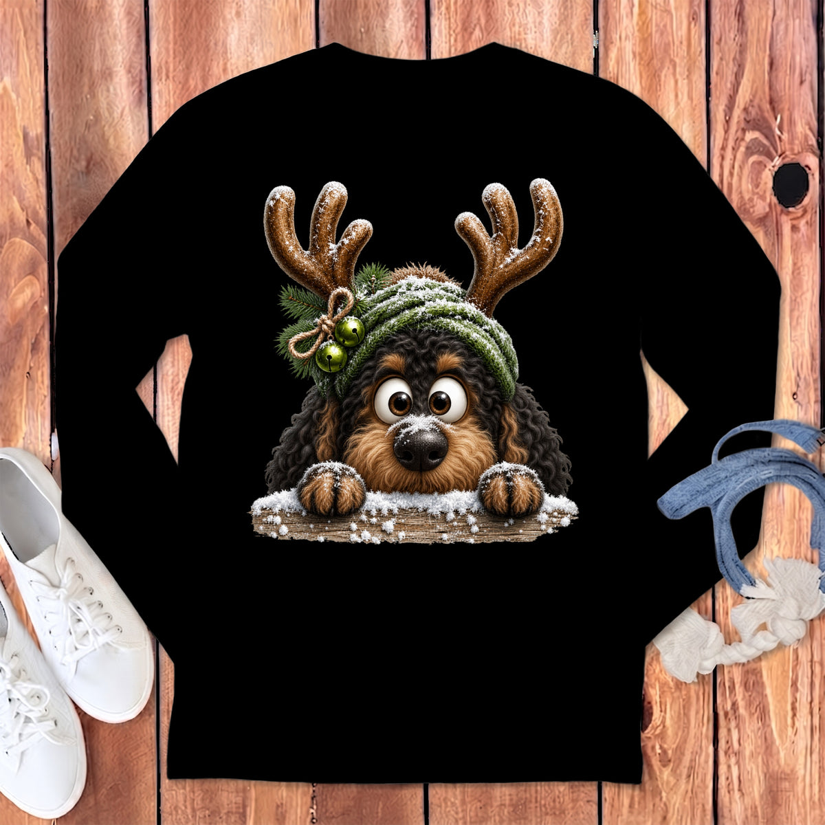 Black long-sleeve shirt with a cartoon dog wearing antlers and a knitted hat.
