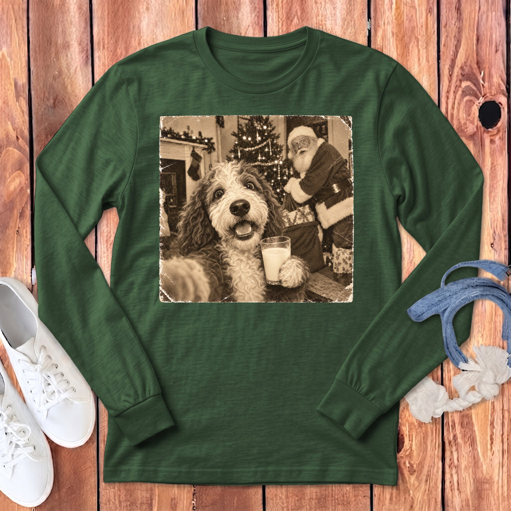 Dark green long-sleeve shirt featuring a vintage-style graphic of a dog holding a glass of milk with Santa Claus in the background.