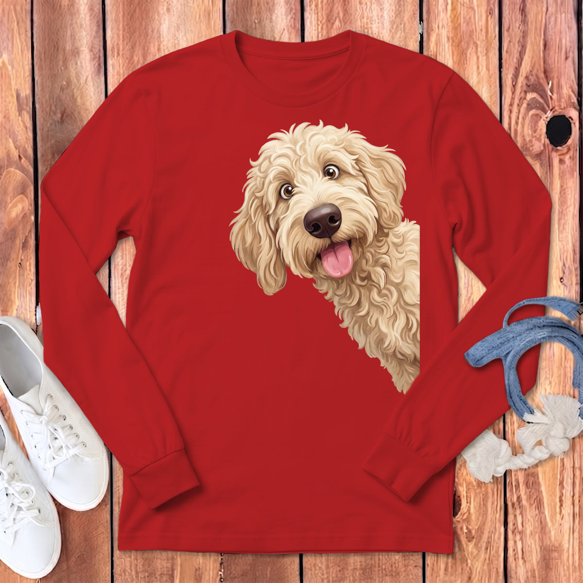 Red long-sleeve shirt with a cartoon golden doodle peeking from the side.