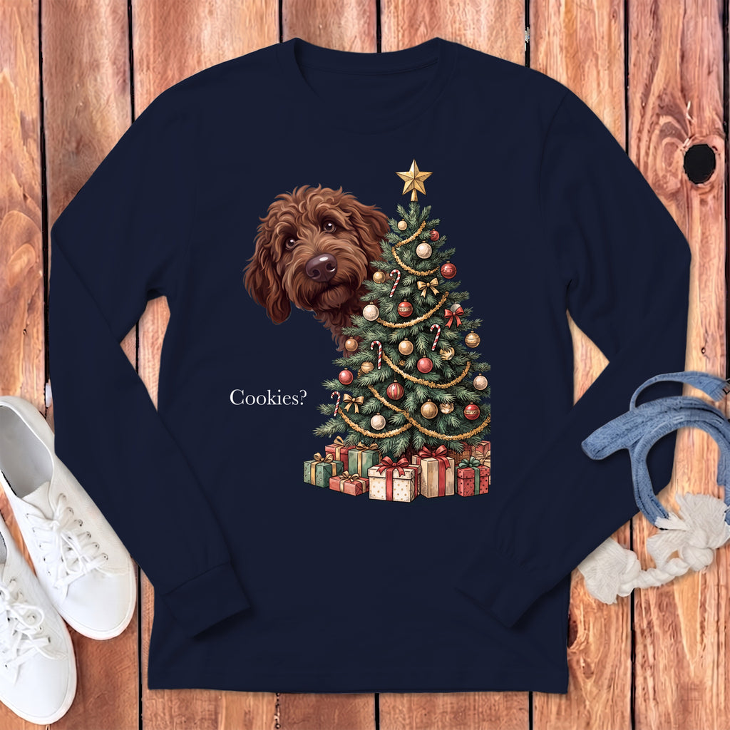Brown dog peeking by a decorated Christmas tree and gifts with "Cookies?" text.