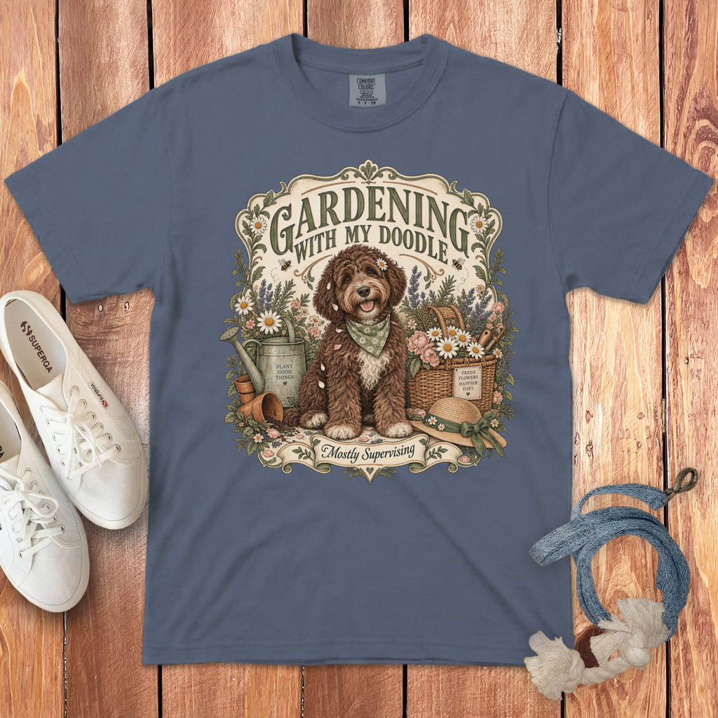 T-shirt with graphic of doodle dog gardening, text "Gardening with my Doodle" and "Mostly Supervising".