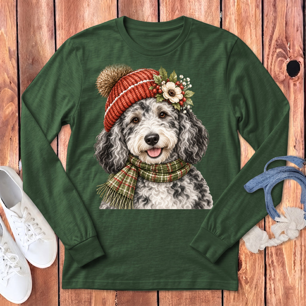 Long sleeve green t-shirt featuring a doodled dog in a festive hat and scarf.