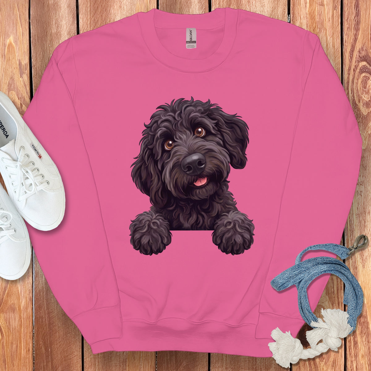 Pink sweatshirt with a black dog illustration and white sneakers.