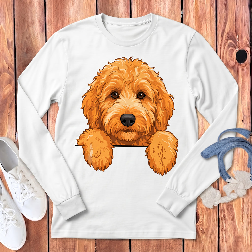 White long-sleeve shirt with an illustration of an orange doodle dog peeking over a black line.