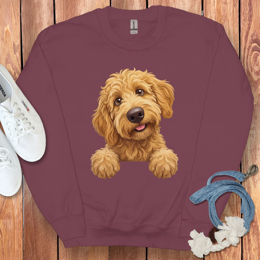 Maroon sweatshirt with a cartoon goldendoodle dog graphic and white sneakers.